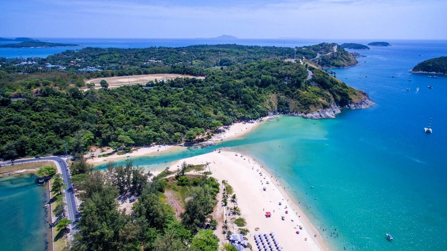 Nai Harn Beach bay surrounded by green hills