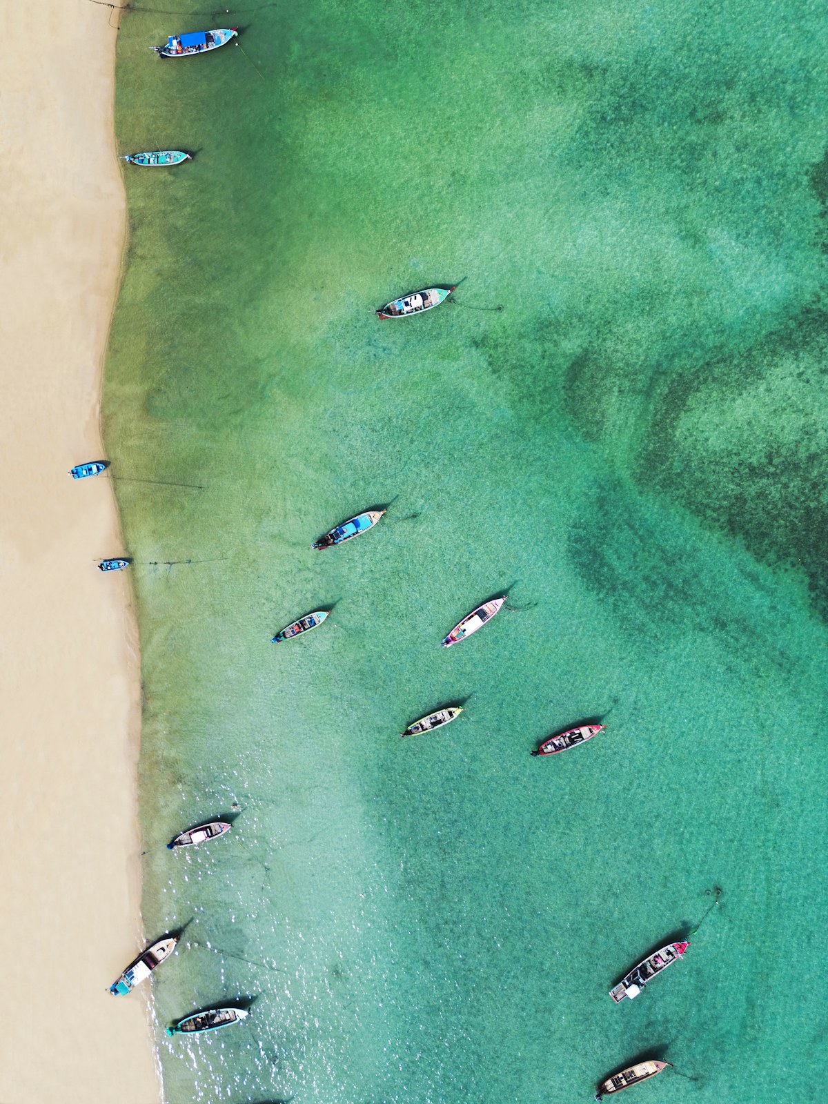 Rawai Beach coastline and long-tail boats